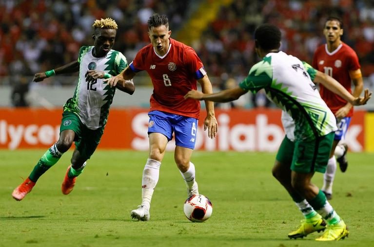 Costa Rica's Bryan Oviedo in action with Nigeria's Ejeh Isaiah