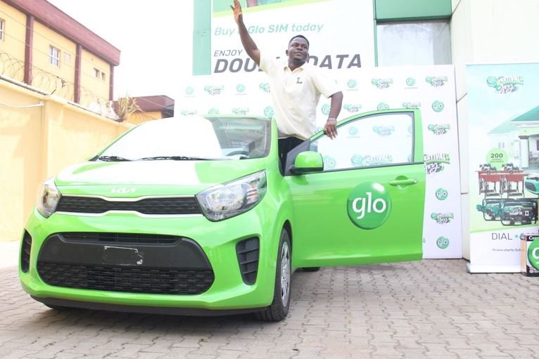 Enakpomu Harrison poses with his Glo Festival of Joy prize