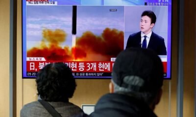 People watch a TV broadcasting a news report on North Korea firing a ballistic missile off its east coast, in Seoul, South Korea on November 3, 2022