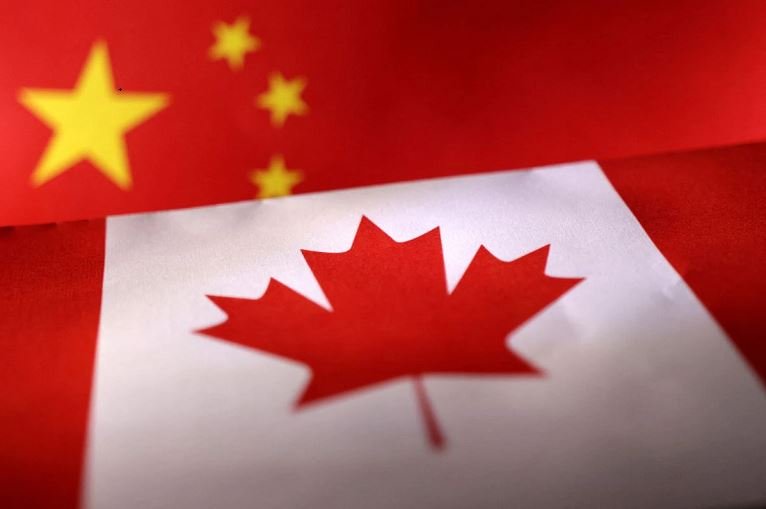 Printed Chinese and Canada flags are seen in this illustration. REUTERS Dado Ruvic Illustration.... Quebec