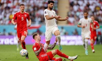 Wales' Joe Rodon in action with Iran's Mehdi Taremi
