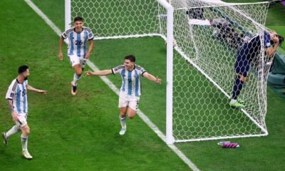 Argentina's Julian Alvarez celebrates scoring their second goal with Lionel Messi and Nahuel Molina