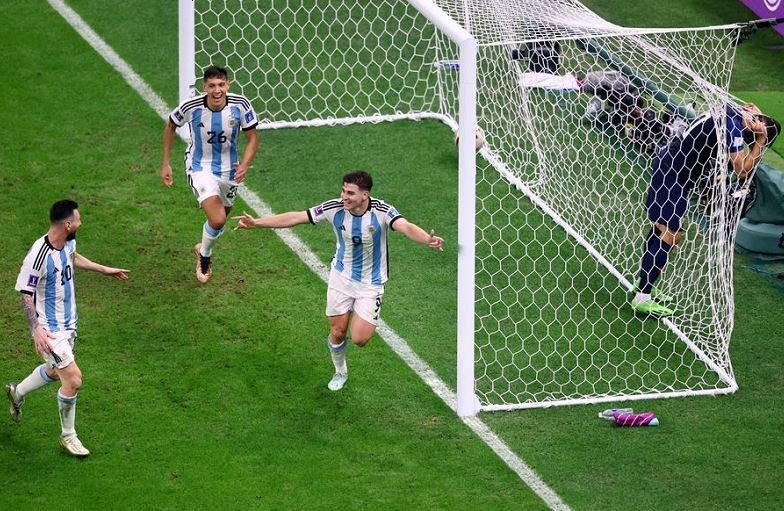 Argentina's Julian Alvarez celebrates scoring their second goal with Lionel Messi and Nahuel Molina