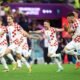 Croatia's Lovro Majer, Josip Juranovic and Josko Gvardiol celebrate winning the penalty shootout