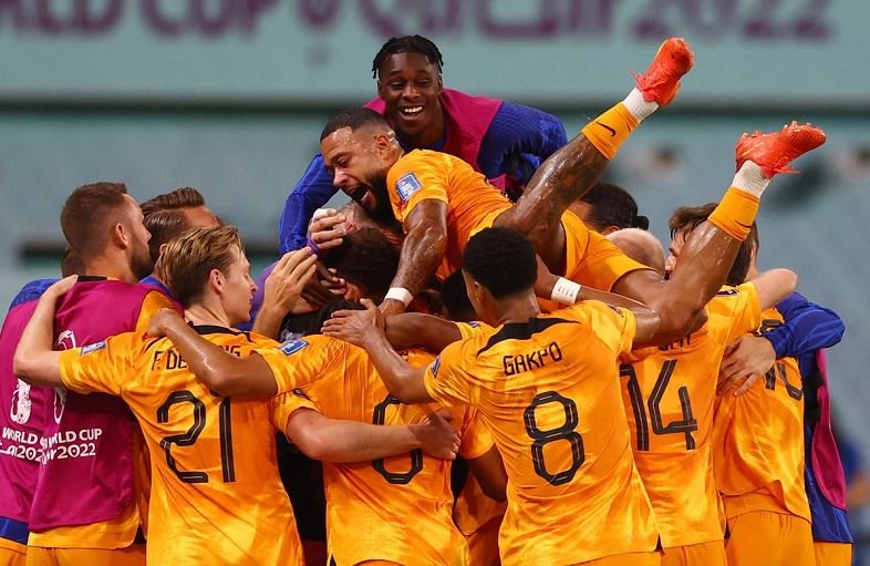 Netherlands' Daley Blind celebrates scoring their second goal with Memphis Depay and teammates REUTERS Matthew Childs