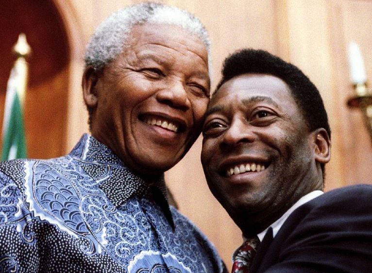 President Nelson Mandela and Brazilian soccer legend Pele smile for photographers at Union Buildings in Pretoria, South Africa, March 24, 1995. REUTERS/Juda Ngwenya