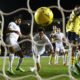 Arsenal's Mohamed Elneny scores their first goal as Takehiro Tomiyasu reacts