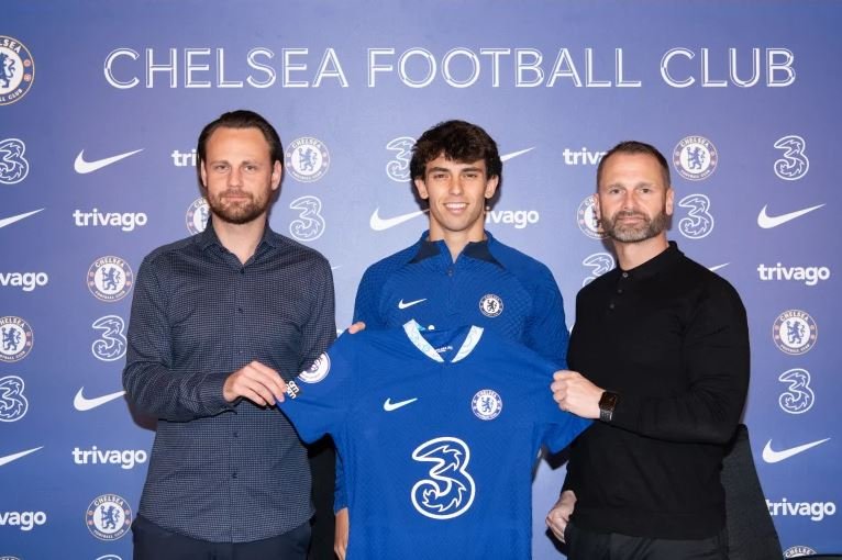 Joao Felix pictured with Christopher Vivell and Paul Winstanley