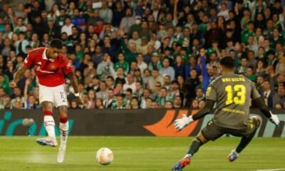 Real Betis' Rui Silva saves a shot from Manchester United's Marcus Rashford