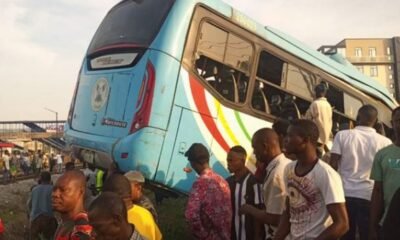 Onlookers surround the bus at the scene of the accident at PwD, Ikeja, Lagos BRT Bus