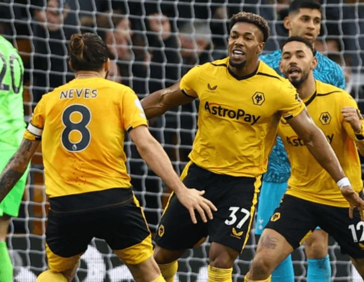 Wolves captain Ruben Neves celebrates with substitute Adama Traore after he scored the winner against Tottenham Hotspur