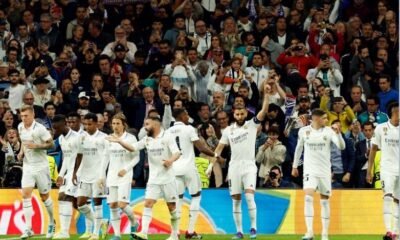 Real Madrid's Karim Benzema celebrates scoring the first goal with teammates