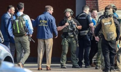 Kentucky Governor Andy Beshear speaks with police deploying at the scene of a mass shooting near Slugger Field baseball stadium in downtown Louisville, Kentucky, US April, 10, 2023. Michael Clevenger/USA Today Network via REUTERS
