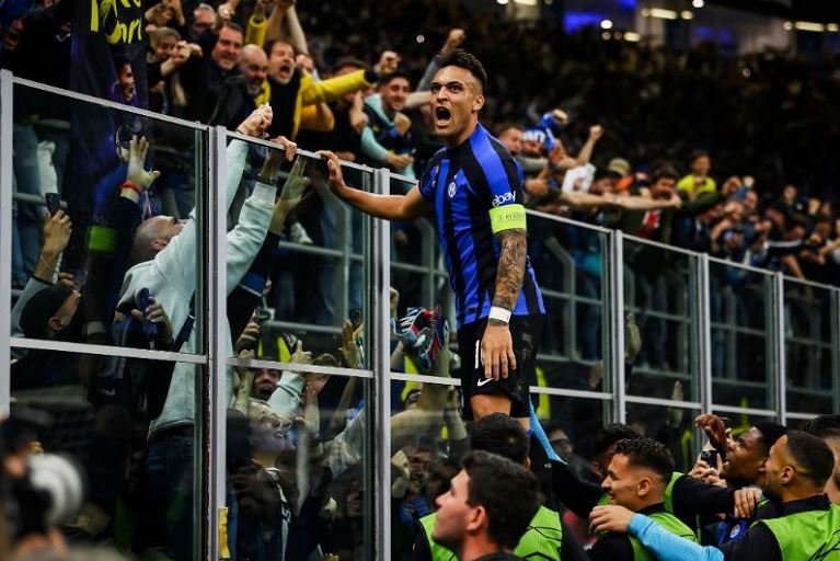 Lautaro Martinez celebrates his goal with Inter Milan fans in the Champions League semi-final second leg