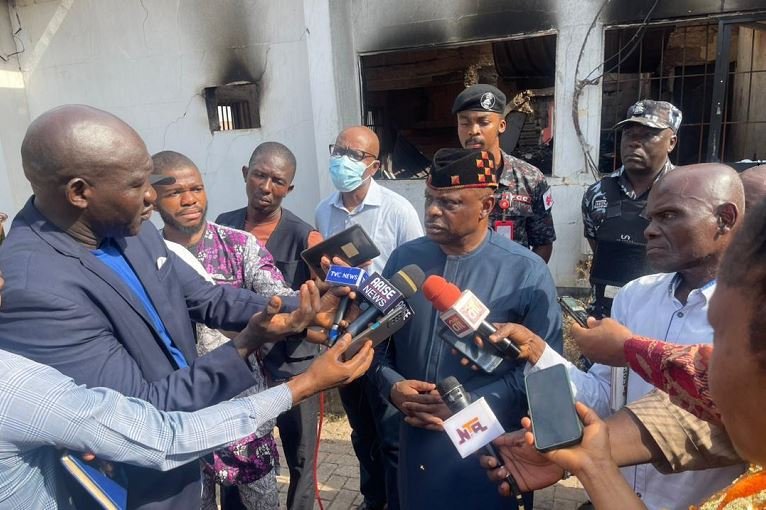 EFCC Secretary to the Commission, Dr. George Ekpungu speaking to journalists after inspecting the burnt office
