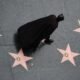 A man dressed as Batman walks on the Hollywood Walk of Fame in Hollywood, Los Angeles, California U.S. November 12, 2017. REUTERS/Lucy Nicholson