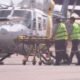 Paramedics push a stretcher following US Marines military aircraft crash in Darwin, Australia, August 27, 2023 in this screen grab obtained from a handout video. AUSTRALIAN BROADCASTING CORPORATION/via Reuters TV/Handout via REUTERS