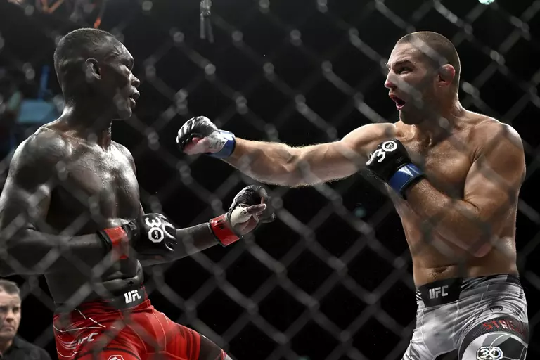 Sean Strickland and Israel Adesanya battle in the middleweight title bout