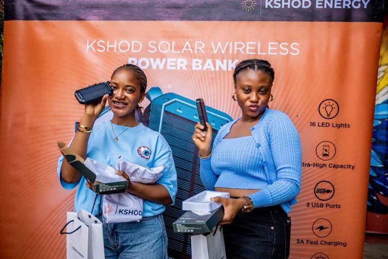 Customers flaunt their KSHOD Wireless Powerbank at the sales fair in Lekki, Lagos State