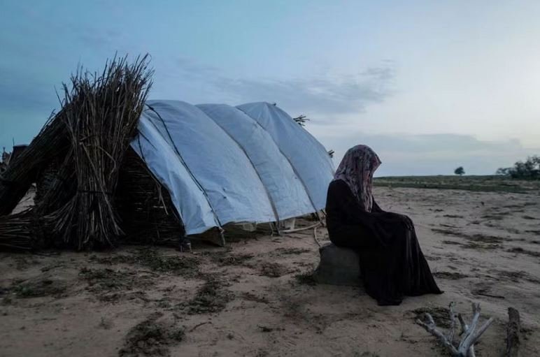 A 15-year-old victim of sexual violence in El Geneina, West Darfur, Sudan is seen outside a makeshift shelter in Adre, Chad, August 1, 2023. REUTERS