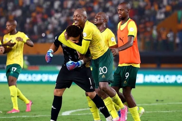 South Africa's Ronwen Williams and Khuliso Mudau celebrate after winning the penalty shootout
