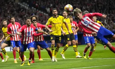 Atletico hold on to edge Dortmund