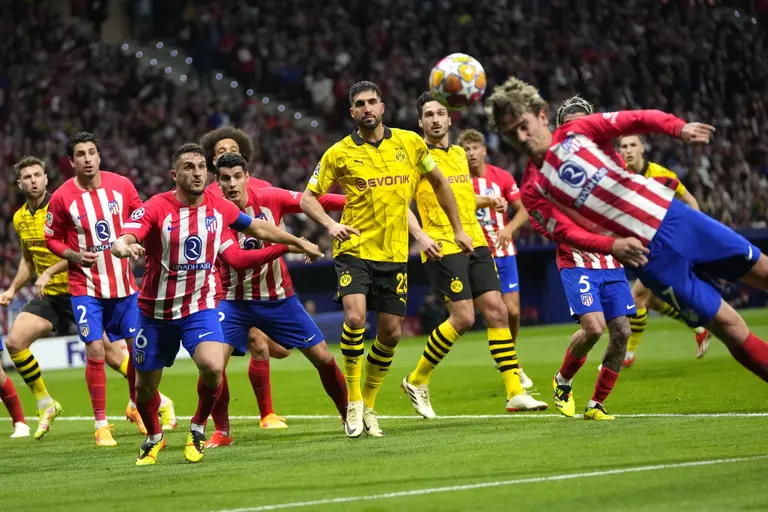 Atletico hold on to edge Dortmund