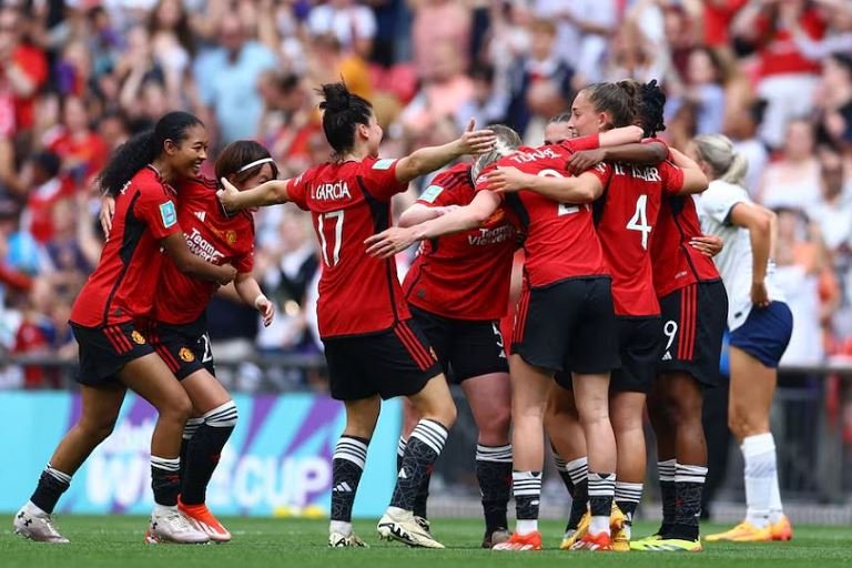 Manchester United players celebrate after winning the women's FA cup