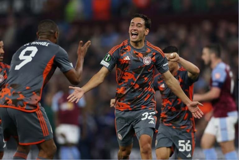 Olympiacos' Santiago Hezze celebrates scoring their fourth goal with Ayoub El Kaabi Action Images via Reuters