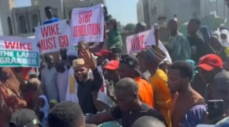 'Wike the land grabber', protest rocks Abuja over mass demolition