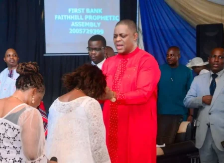 Fani-Kayode laying hands on congregants