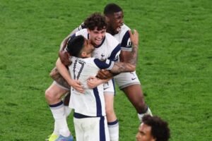 Tottenham Hotspur's Brennan Johnson celebrates with teammates after the full time whistle