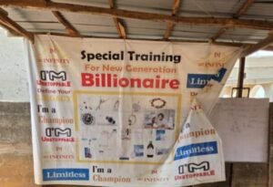 Q-net University banner hangs outside Compensation Layout, Gwagwalada, FCT, Abuja