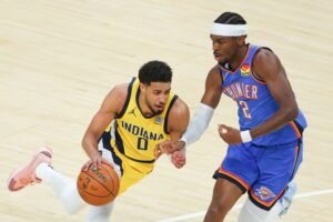 Indiana Pacers guard Tyrese Haliburton (0) drives to the basket against Oklahoma City Thunder guard Shai Gilgeous-Alexander (2) in the first quarter during game six of the 2025 NBA Finals at Gainbridge Fieldhouse. Mandatory Credit: Trevor Ruszkowski-Imagn