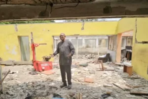 Peter Obi in the ruins of the demolished property