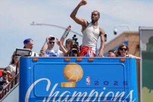 Oklahoma City Thunder guard Shai Gilgeous-Alexander gestures to the crowd as the Oklahoma City Thunder celebrate their first NBA Finals title win with a champions parade throughout downtown Oklahoma City on Tuesday, June 24, 2025. Mandatory Credit: Bryan Terry/USA TODAY NETWORK via Imagn Images