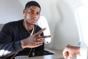 Marcus Rashford pictured playing card on a private jet en route Barcelona